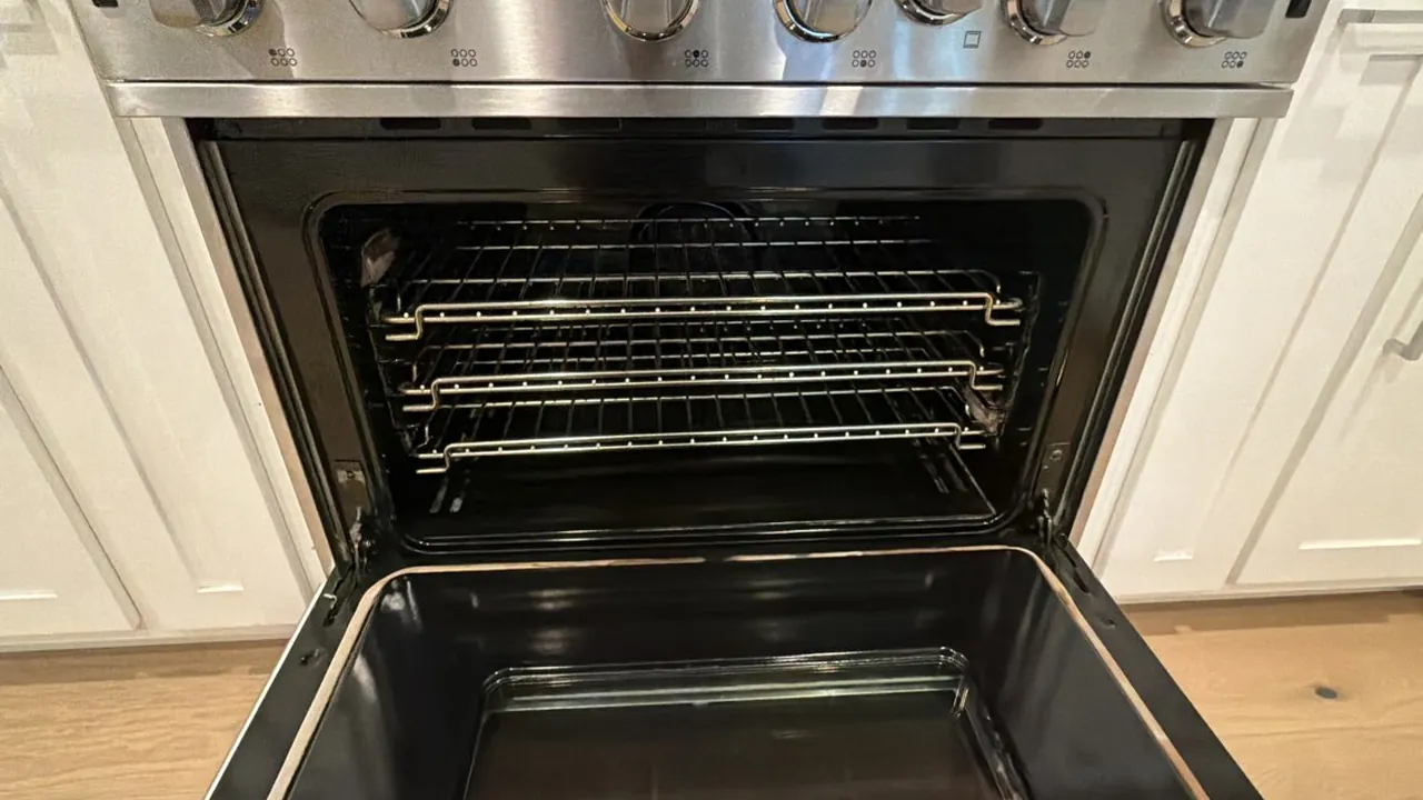 Wall oven open on a spotless interior, the difference a deep clean makes to an appliance