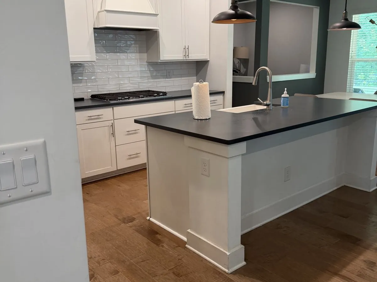 Kitchen island and open-plan living space in a Metro Atlanta home after a cleaning visit
