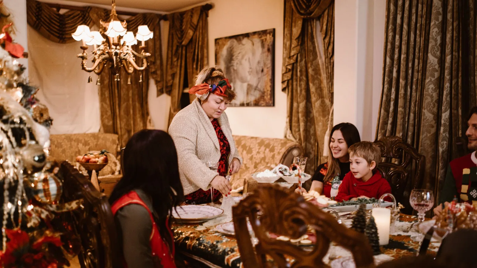 Family gathered around a festive dinner table at home